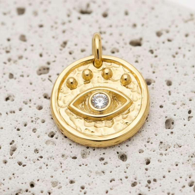 Gold plated third eye charm — hammered disc with radiating dots for intuition