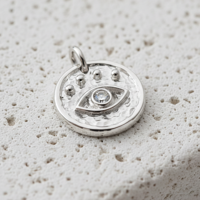 Silver plated third eye charm — hammered disc with radiating dots for intuition