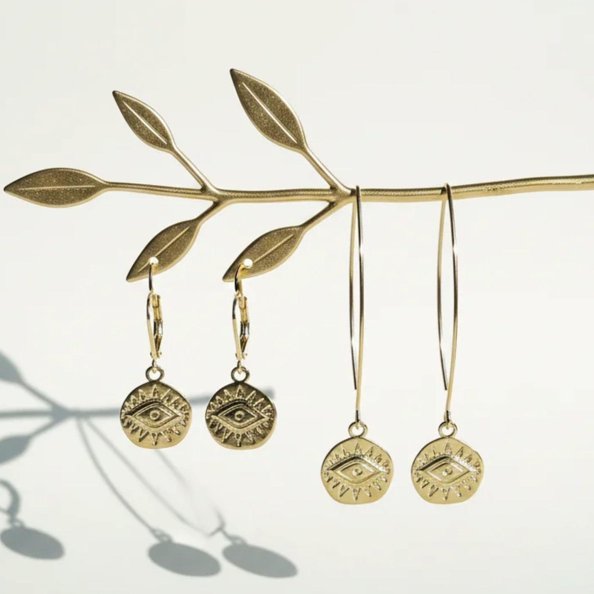 Third eye mini medallion earrings on both leverback and long earwires in gold plate