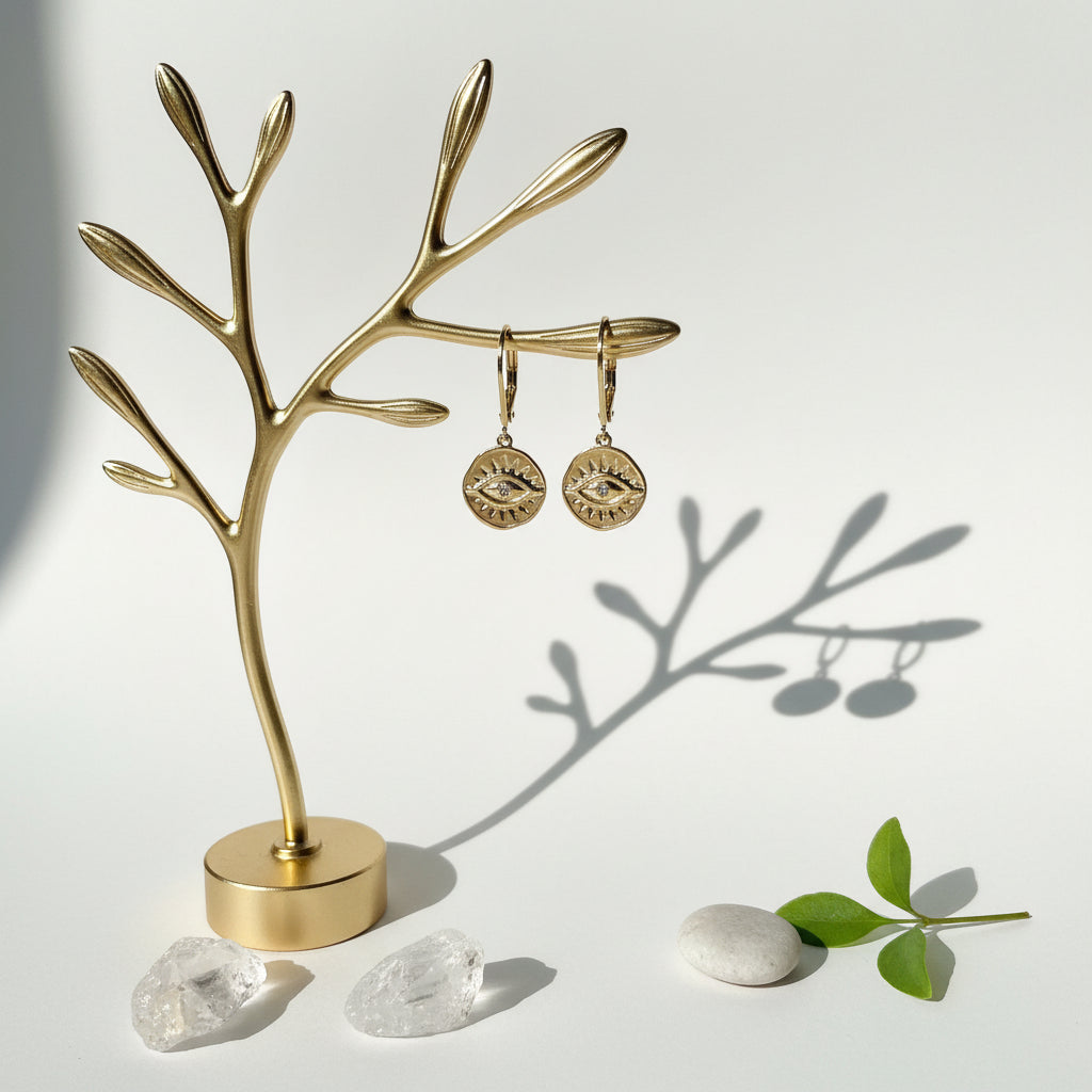Third eye mini medallion crystal earrings hanging from a branch — jewelry for intuition