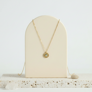 Third eye mini medallion necklace with a faux opal centre in gold plate — jewelry for intuition