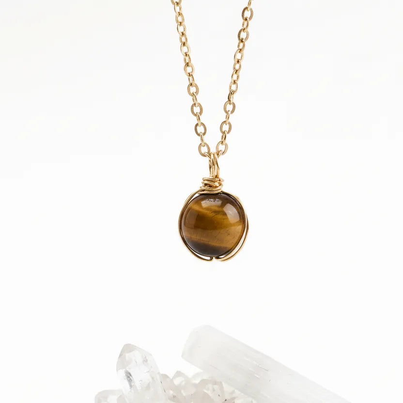 tiger eye gold necklace with a on a white background