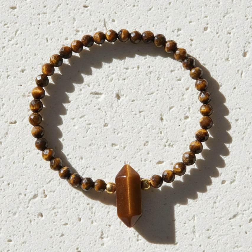 Bracelet with brown beaded design on a white background