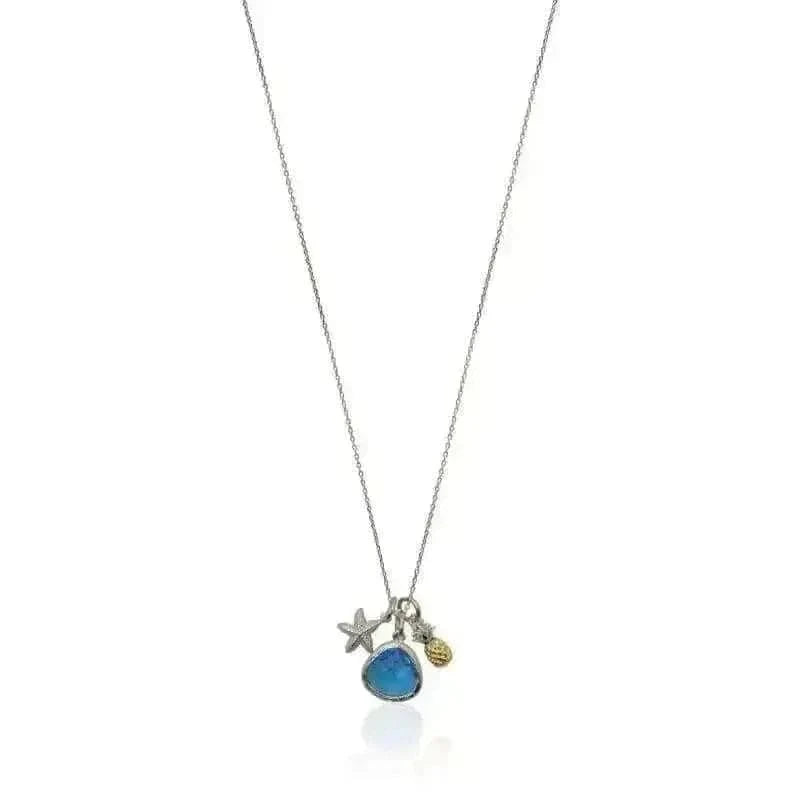 Necklace with blue pendant, starfish, and ball charm on a white background