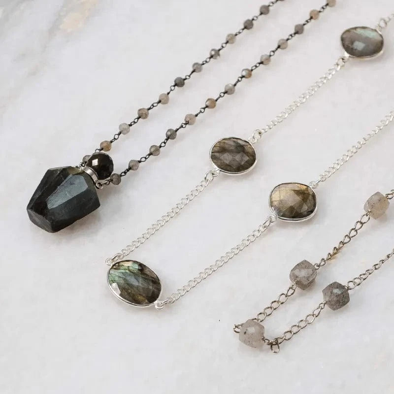 Three labradorite necklaces on a light background