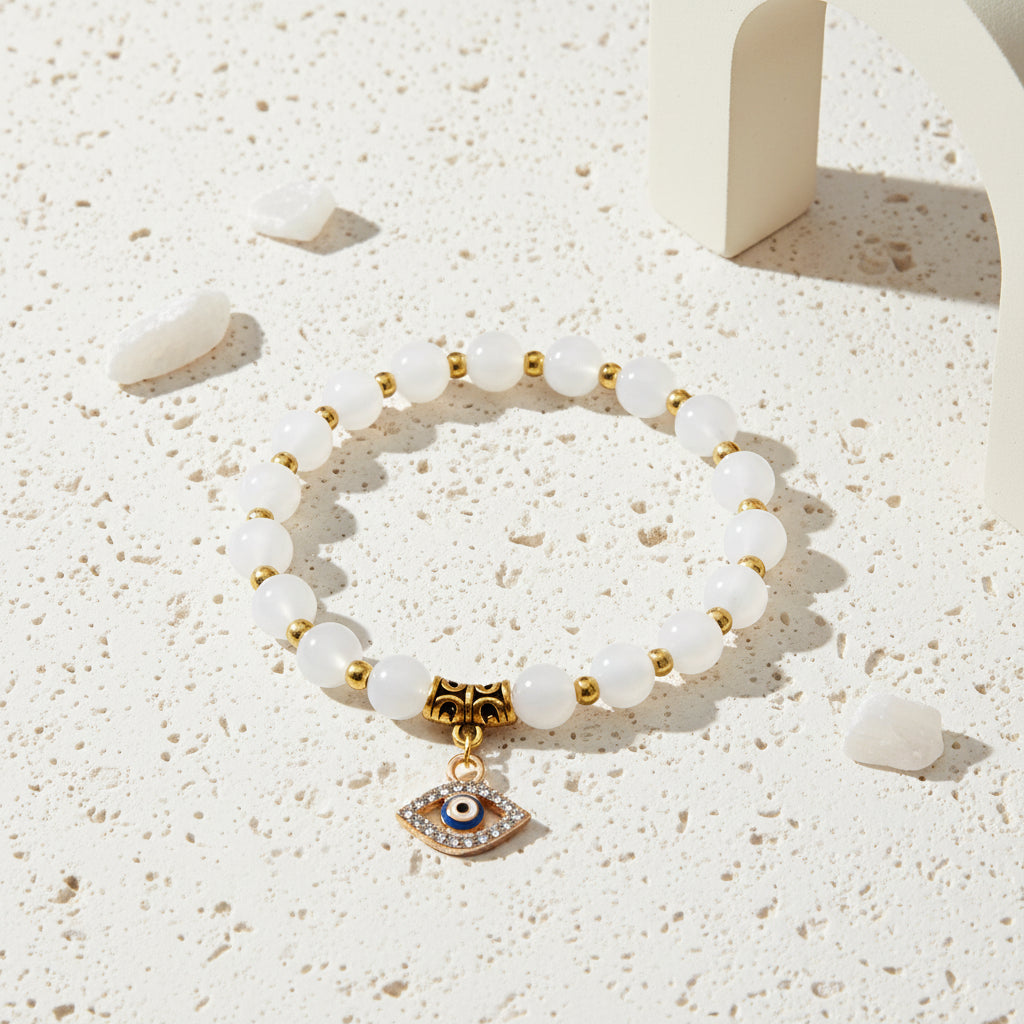 White stone evil eye stretch bracelet on natural stone beads — symbol jewellery for a clean slate