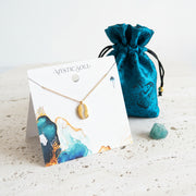 Winding path medallion necklace in gold with Mystic Soul Jewelry gift bag and tag