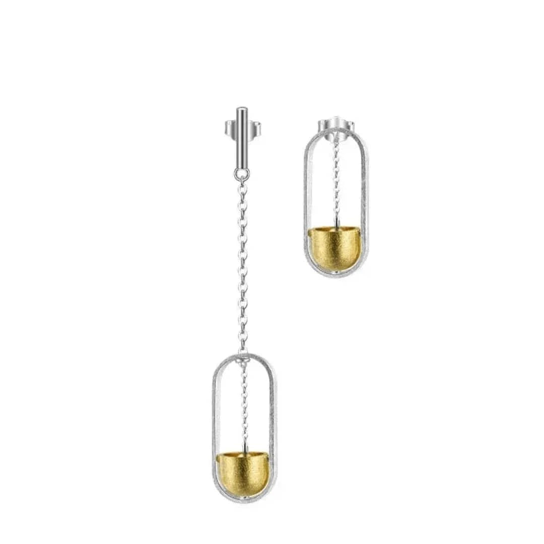 Pair of earrings with gold and silver design on a white background