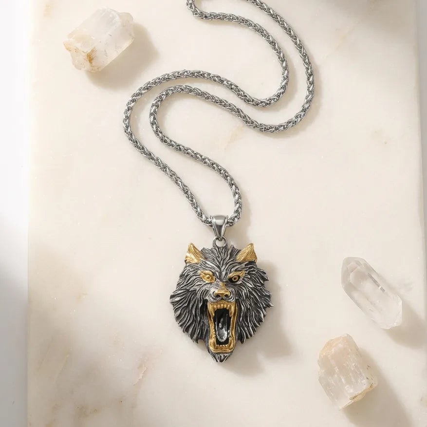 Wolf head pendant necklace on a marble surface