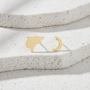 Gold cat-shaped earrings on a white background
