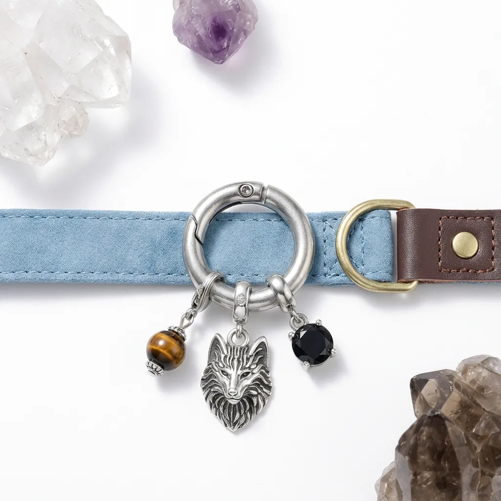 Dog collar with wolf charm and crystal stones on a white background