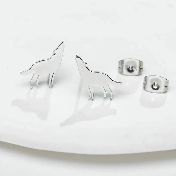 Wolf-shaped silver earrings on a white background with 'jisensp' branding.
